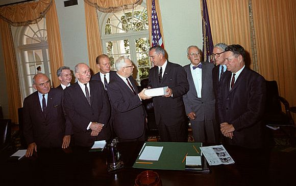 The Warren Commission presents its report to President Johnson The Warren Commission presents its report to President Johnson