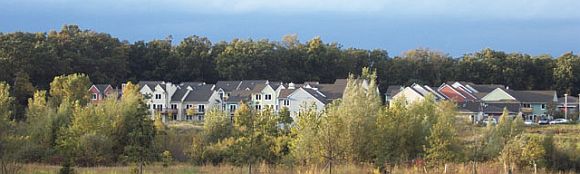 The Sunward Cohousing community illustrating greenspace preservation, tightly clustered housing, and parking on periphery, Ann Arbor, Michigan, 2003. The Sunward Cohousing community illustrating greenspace preservation, tightly clustered housing, and parking on periphery, Ann Arbor, Michigan, 2003.